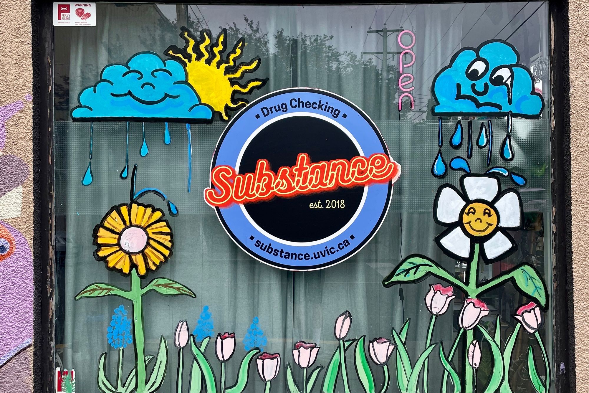 April showers bring window art flowers. Artwork by @darcie.dark.